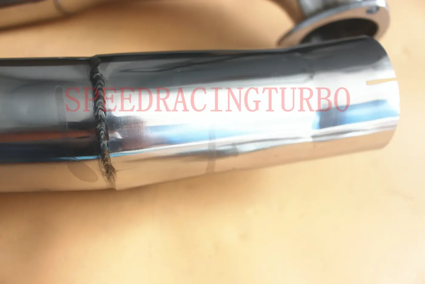 Top view of the Y-pipe with flanges aligned for installation on a Ram 1500 engine