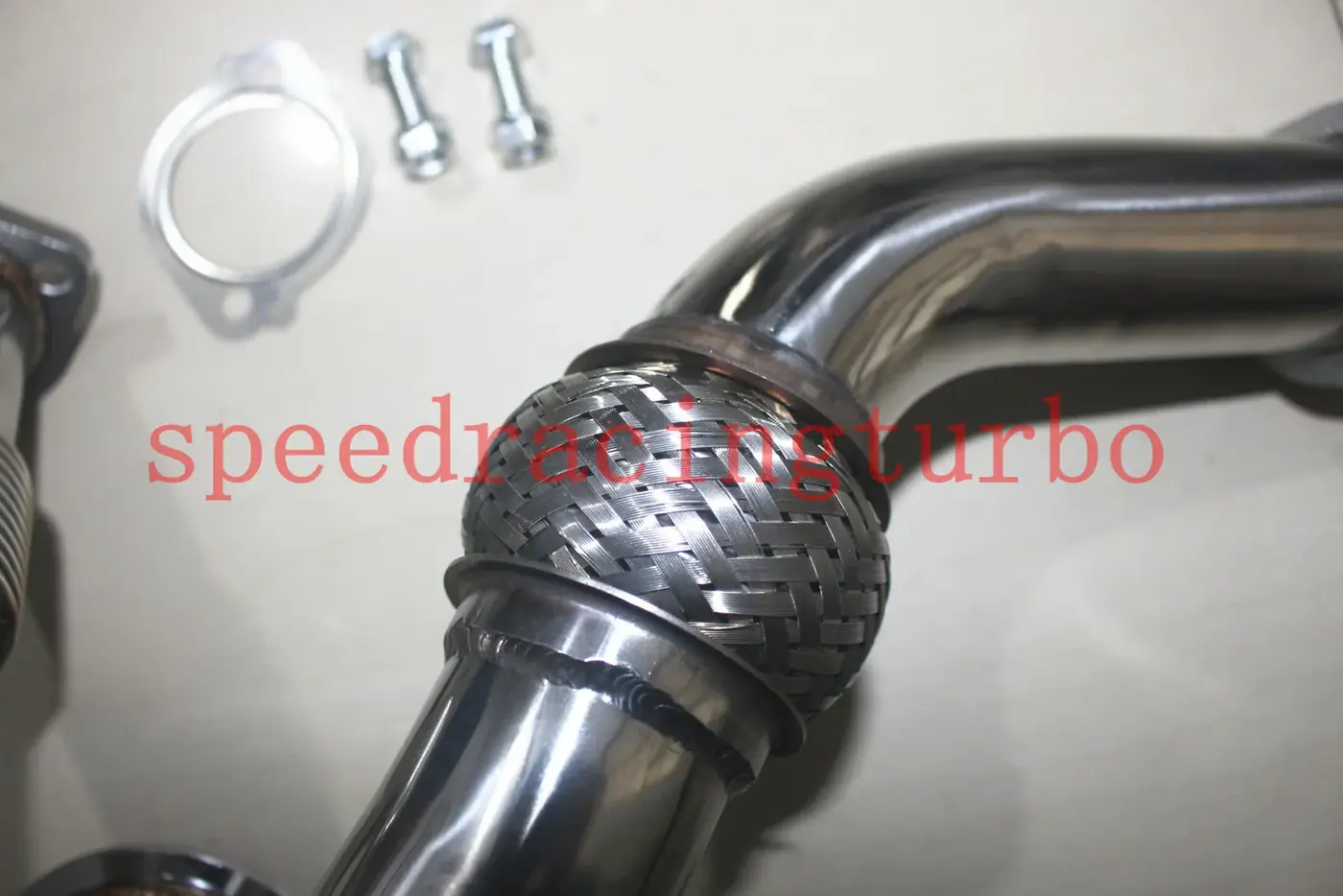 Front view of the X-pipe with bolt holes aligned for factory mounting