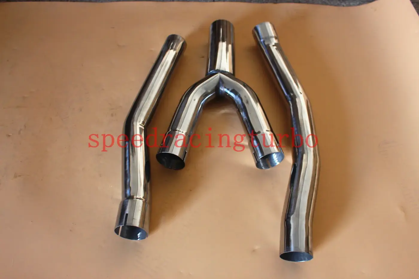 Y-pipe with 3 inch outlet and 16 gauge wall thickness connected to the header