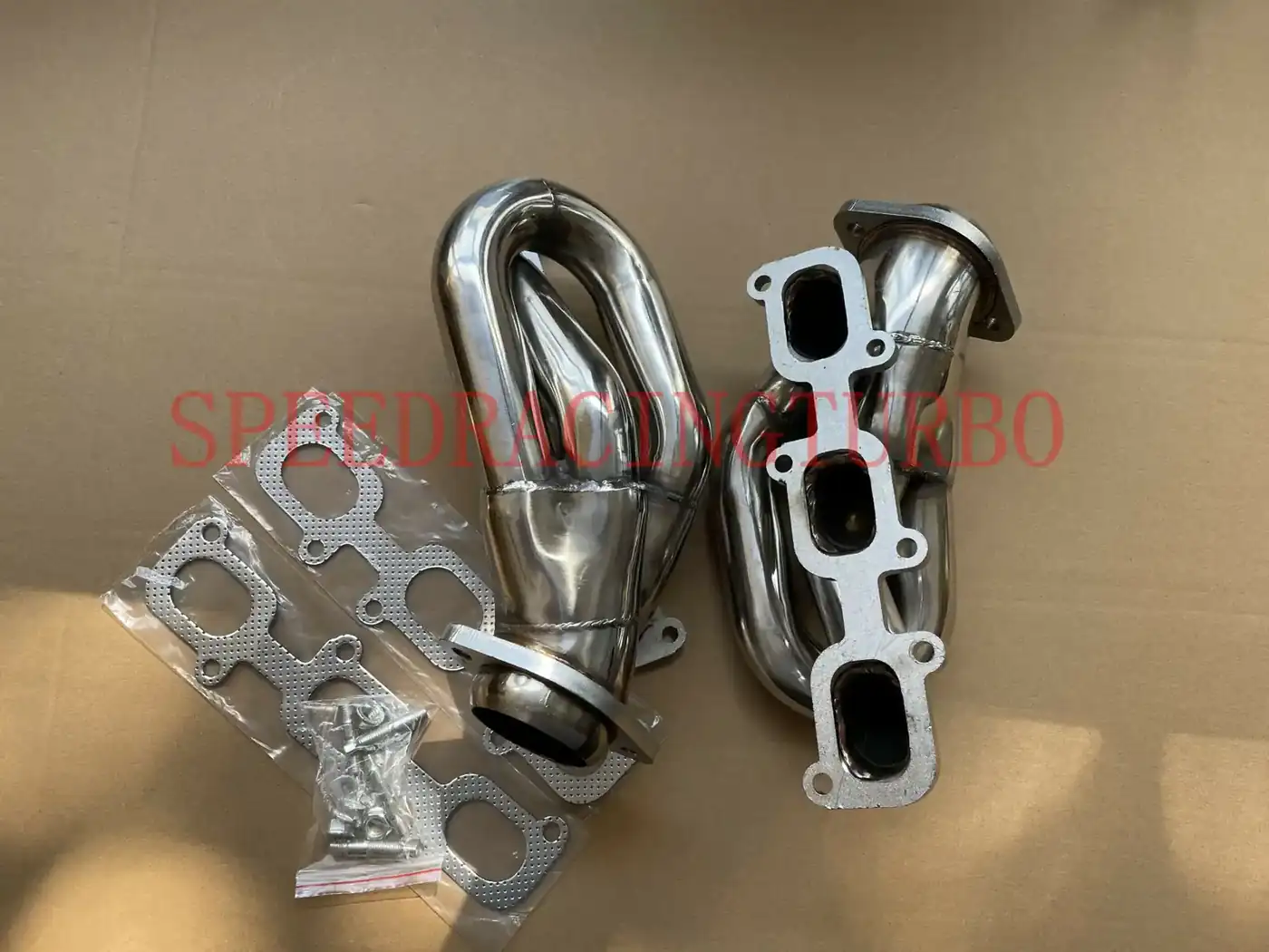 Side view of a 3-1 shorty exhaust header kit showing the 1-5/8 inch inlet and 2-7/16 inch outlet
