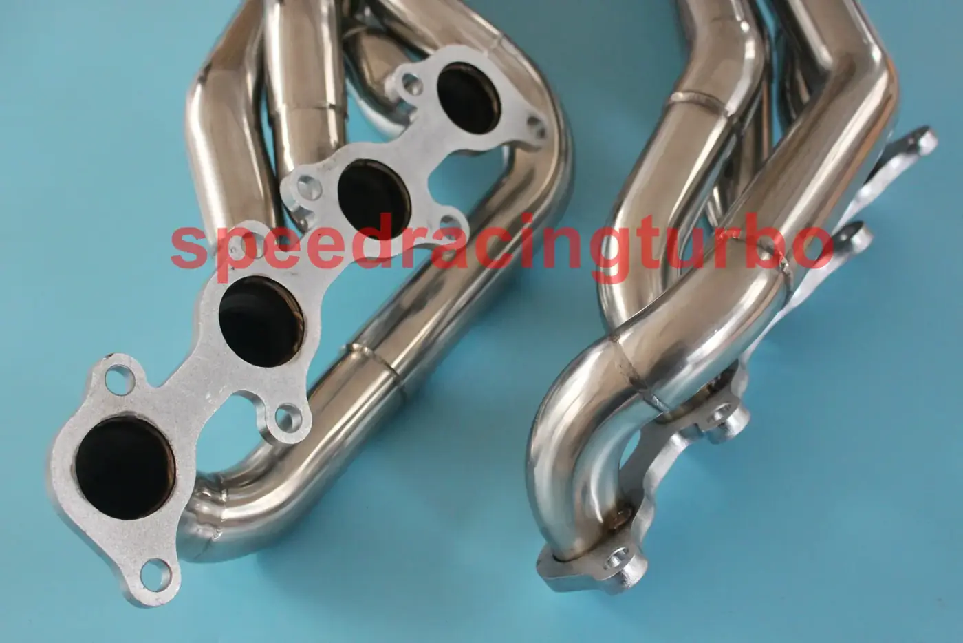 Side view of a long tube header showing 1.75 inch inlet and 2.5 inch outlet with included gaskets and bolts