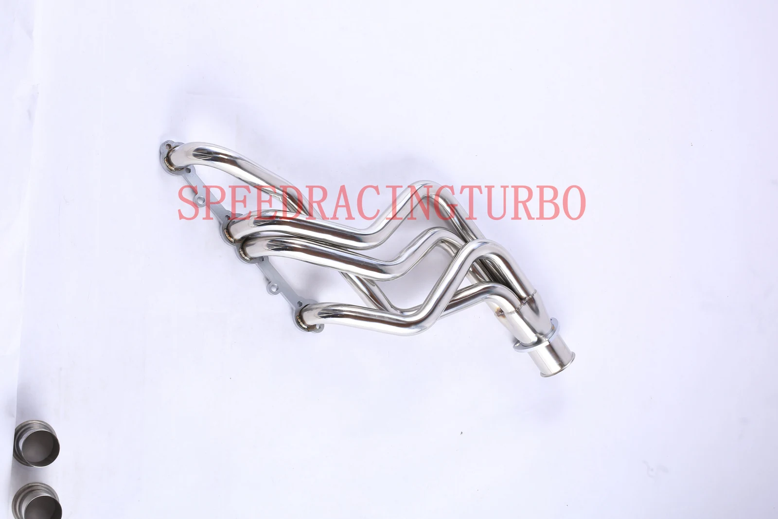 Side view of polished header set showing 1-3/4 inch primary tubes and TIG welded joints