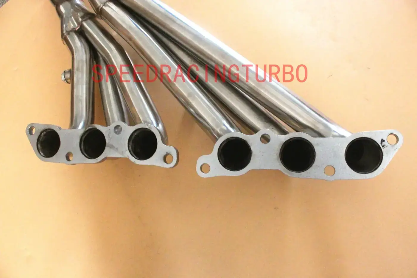 Top view of header showing polished surface and bolt pattern