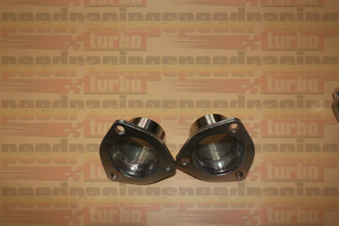CNC machined flange with 3/8 inch thickness and bolt holes on a 201 stainless header