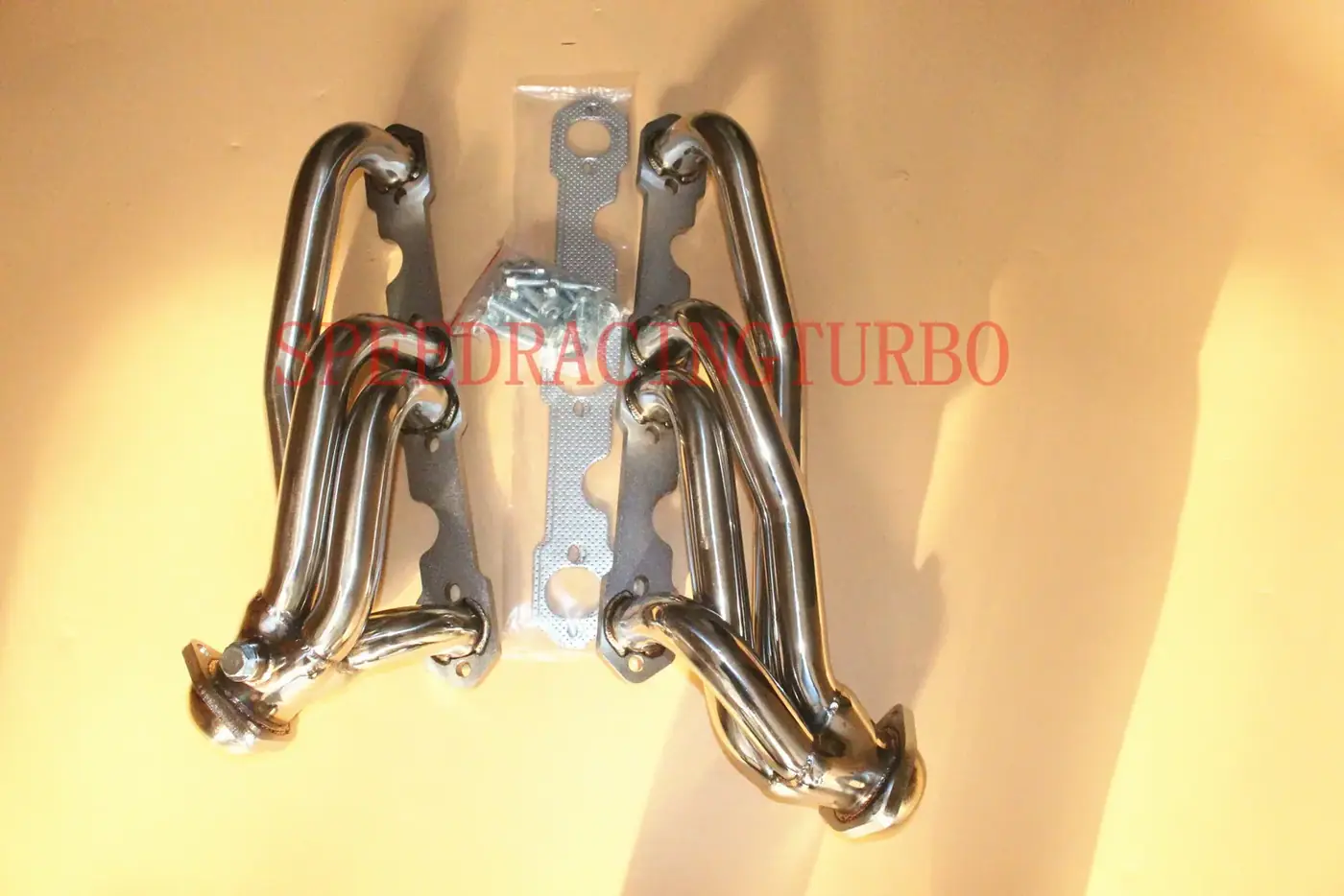 Mirror polished stainless steel 1-3/4 inch shorty exhaust header with CNC machined chrome plated flanges