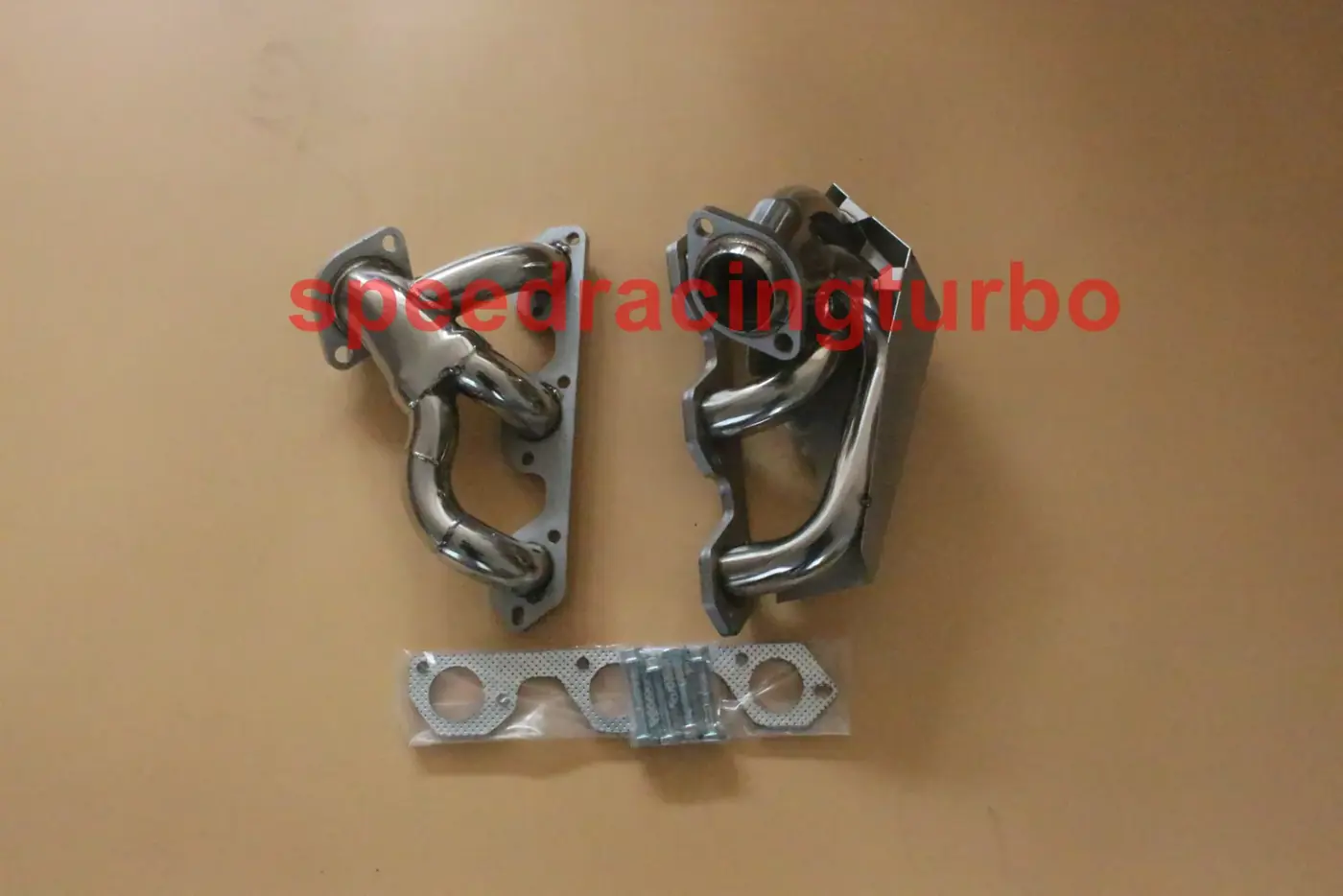 Close-up of CNC machined flange on 1-7/8 inch header with polished finish