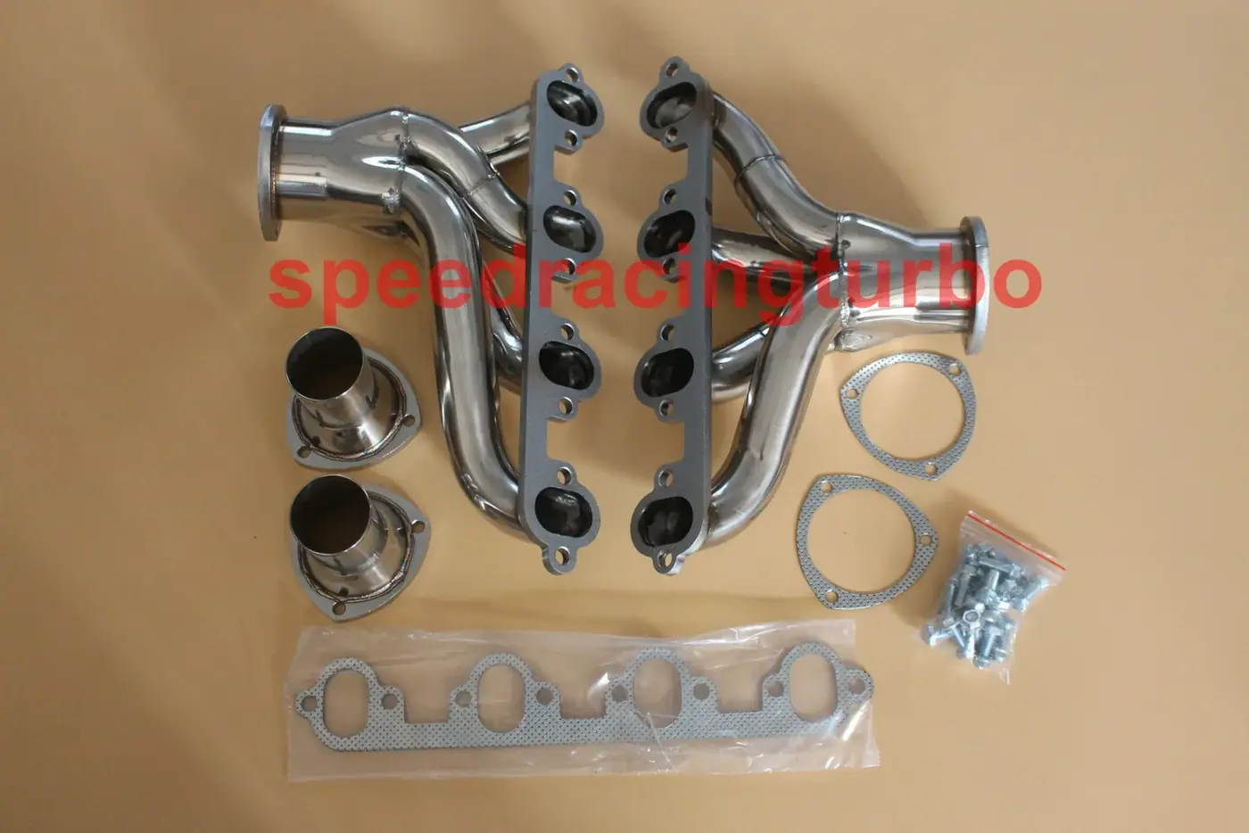 Side view of stainless steel header pair showing 4 to 1 design and 3-1/2 inch outlet with 2.5 inch collector reducer