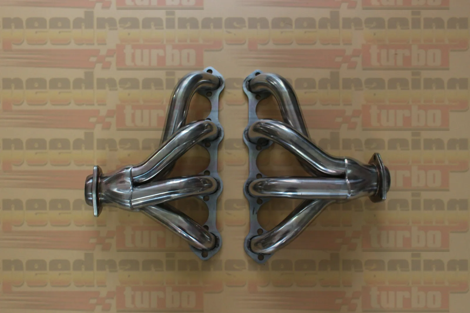 Polished stainless steel exhaust header for 1986-1993 Ford Mustang 5.0L with chrome plated flanges and round port design