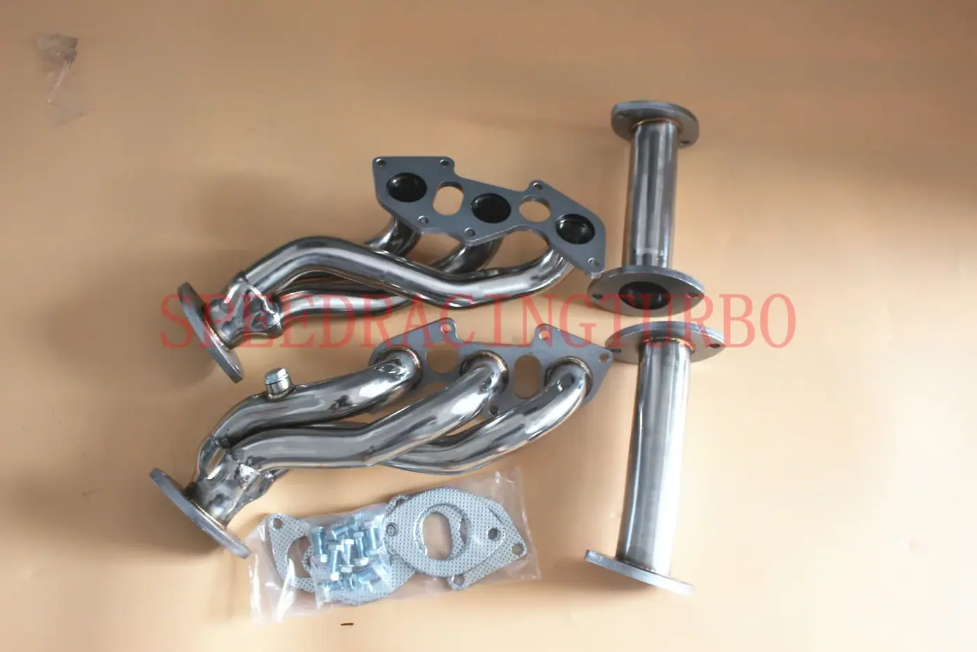 Two-piece stainless steel exhaust header for 2006-2013 Lexus IS250 and IS350 with polished finish and CNC machined flanges