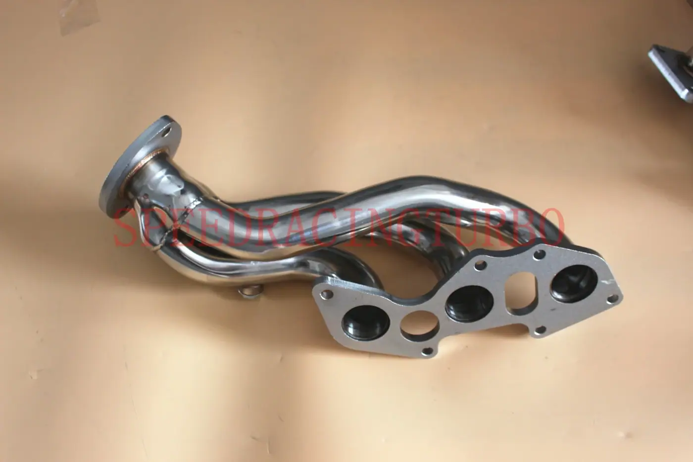 CNC machined flange with (3-1)x2 bolt pattern on a polished exhaust header for Lexus IS250 IS350
