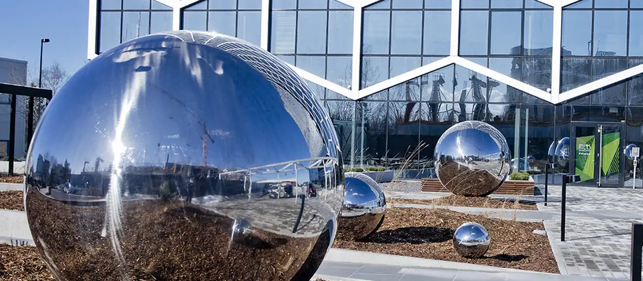 Group of mirror polished stainless steel spheres installed in Estonia