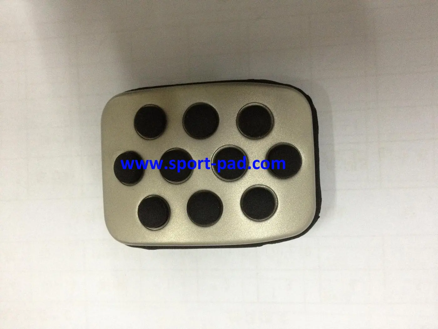 GM Sport Pads 2 — brushed stainless face with round rubber studs, compact rectangular outline