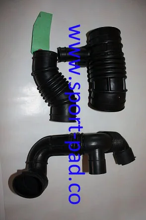 Various Hoses — group of moulded rubber elbow hoses with different bend angles and end forms