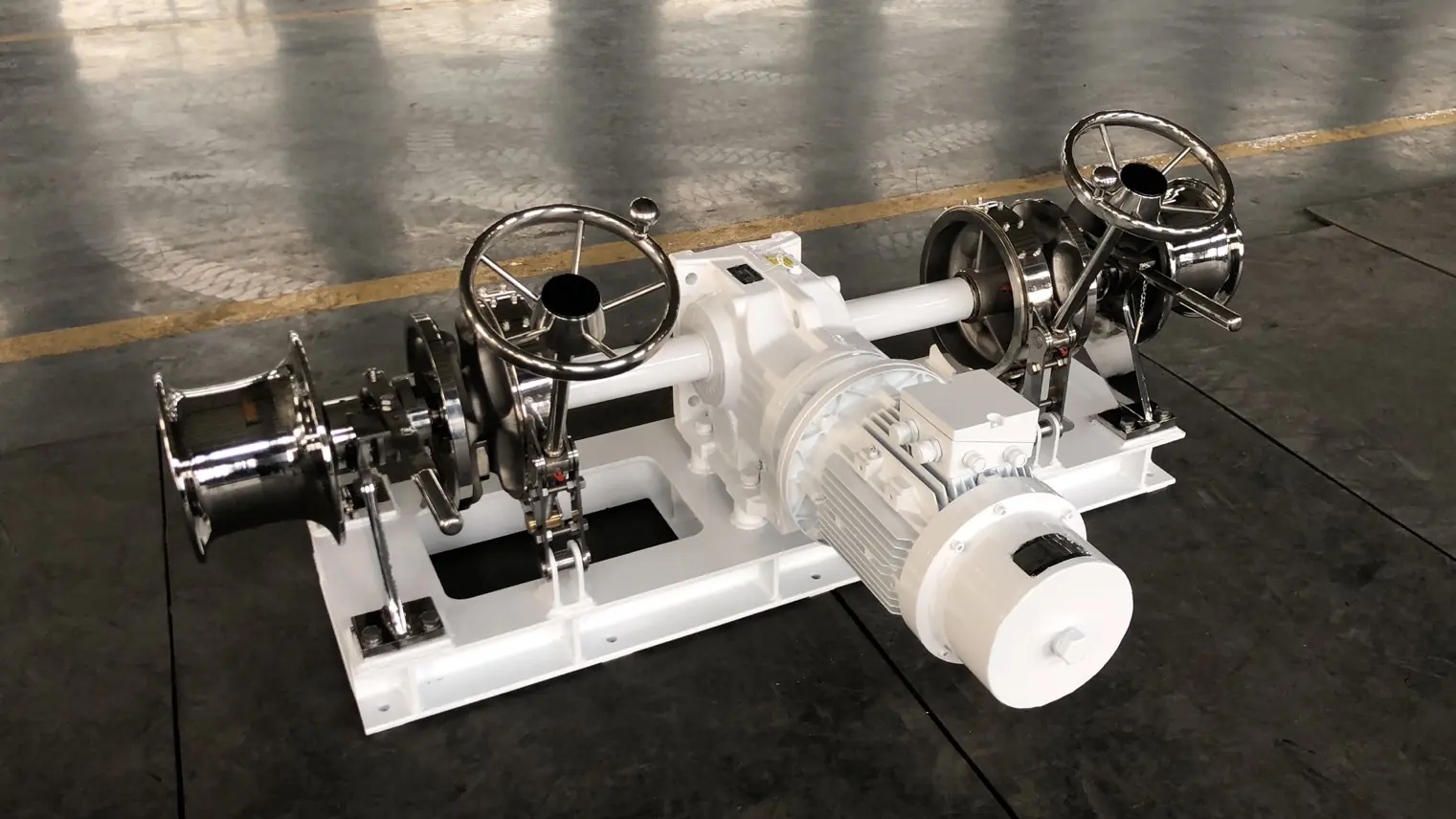 Double gypsy stainless steel anchor windlass on the workshop floor before factory acceptance testing