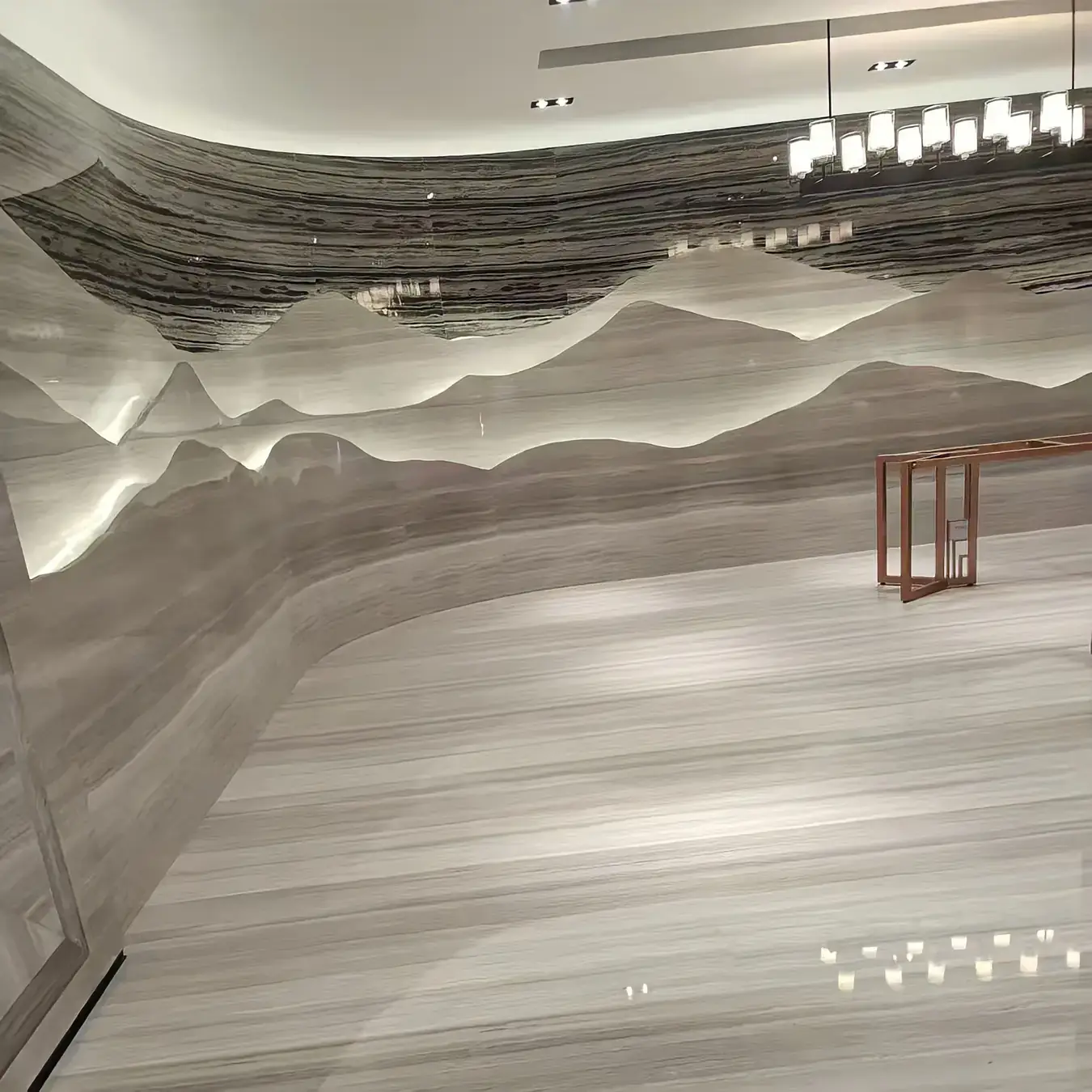 Bookmatched natural stone wall panels in a lobby interior