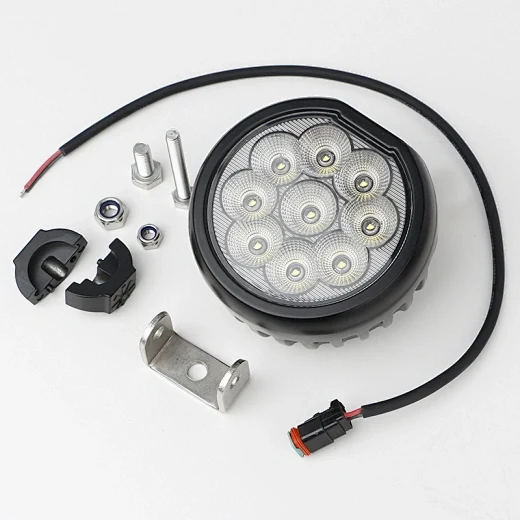 Front view of the round LED tractor light showing the nine Osram LED array and polycarbonate lens