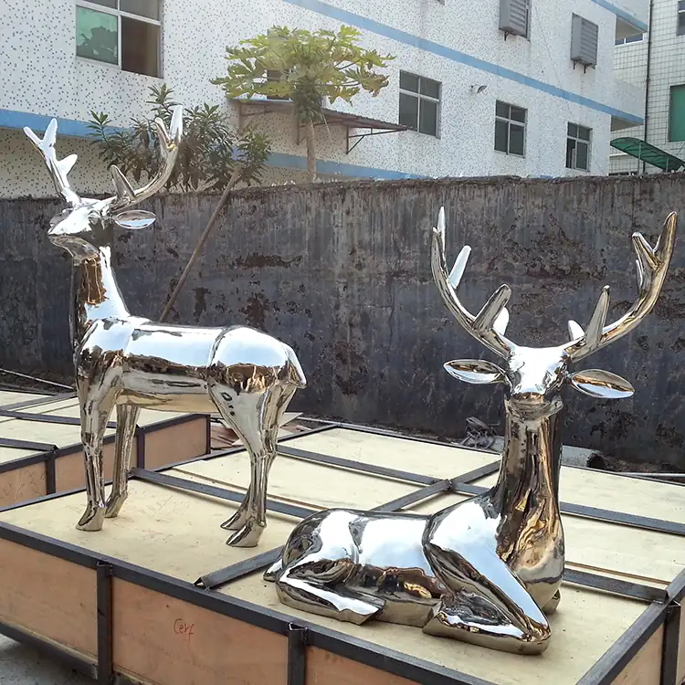 Stainless steel Sika deer sculpture standing on a park lawn with natural polished finish