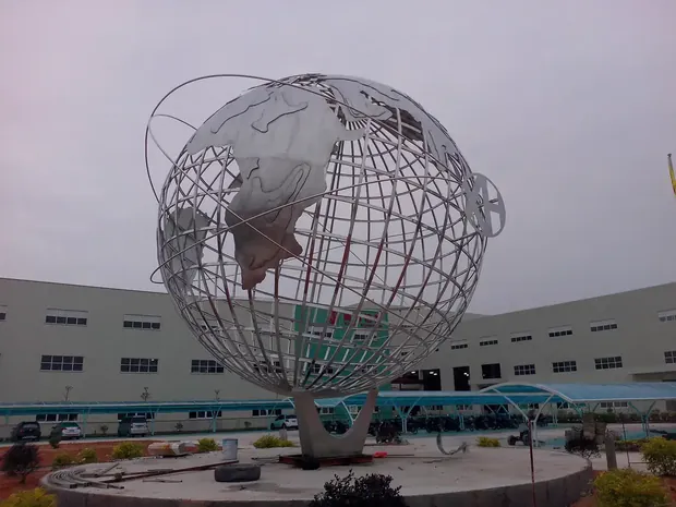 6M stainless steel globe with tubular longitude and latitude frame on a concrete base