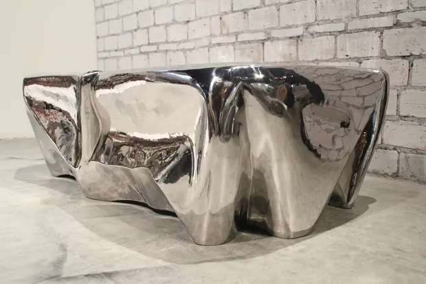 Coffee table with rounded edges and hollow construction in an interior design setting