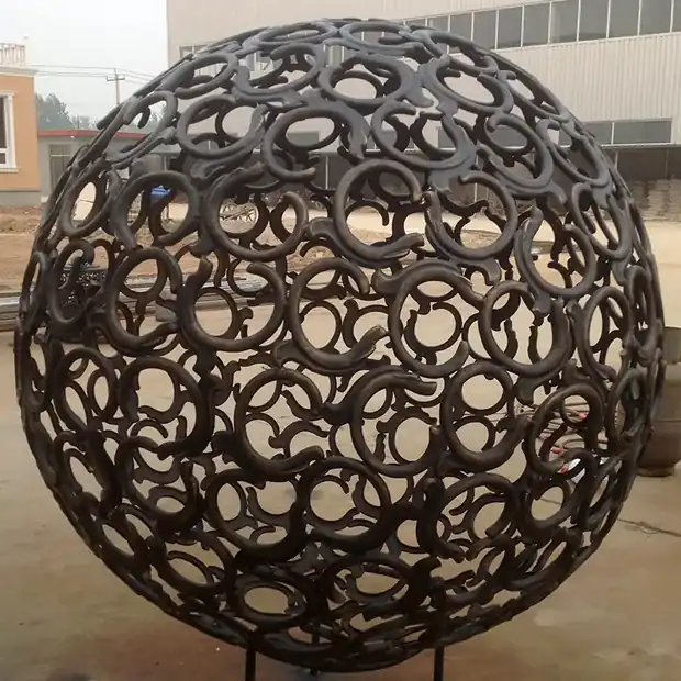 Cast copper chimney sculpture with natural finish beside a modern living room sofa