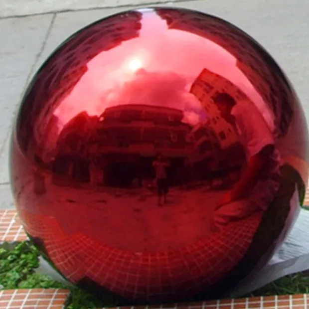 Blue steel ball mounted on a wall in a modern interior