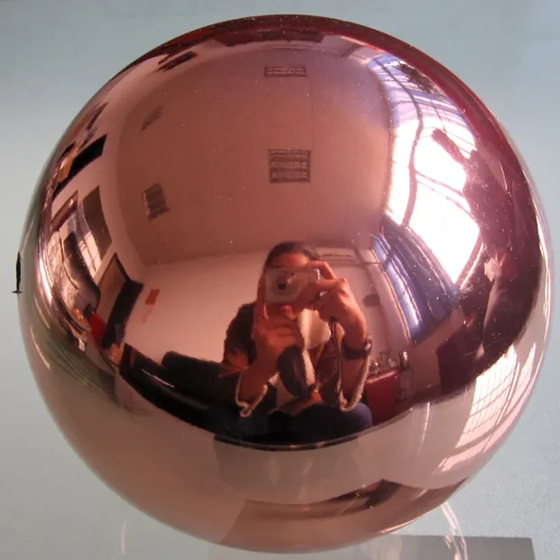 Close-up of the blue baked lacquer surface on a stainless steel ball