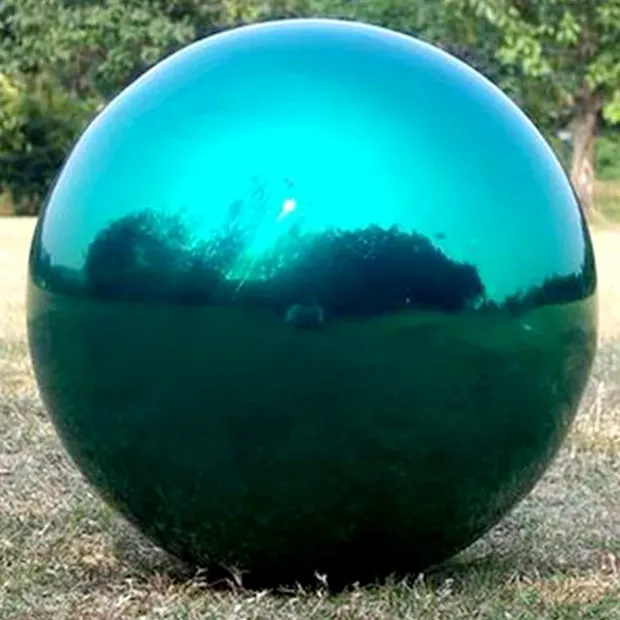 Group of blue stainless steel balls arranged in a geometric pattern