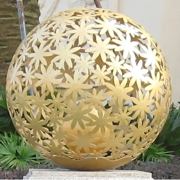 Cluster of stainless steel hollow balls arranged in a geometric pattern on a building facade