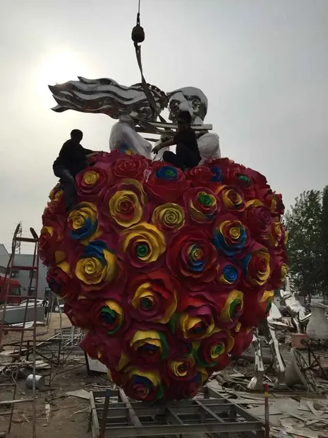 Stainless steel LOVE sculpture with color electroplating in a theme park setting