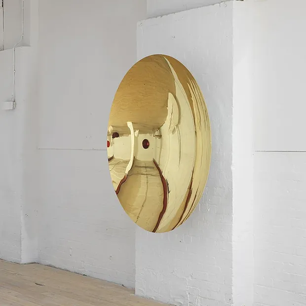 Wall-mounted stainless steel ball top in a residential living room