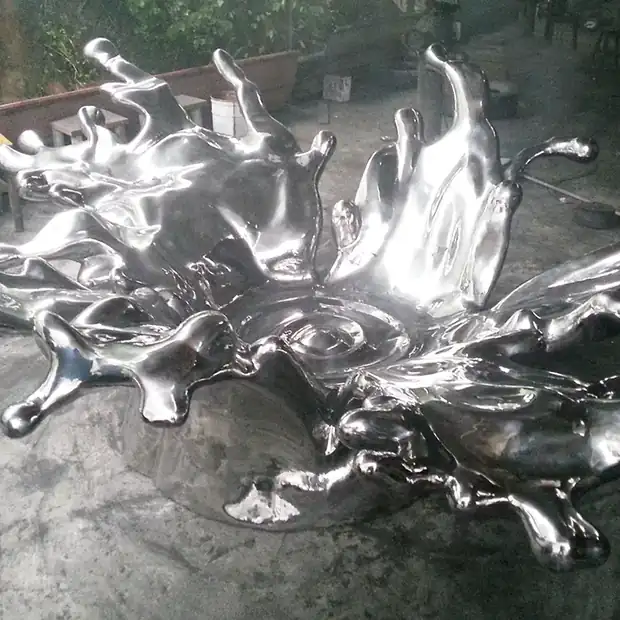 Group of forged stainless steel flower forms suggesting motion and flow