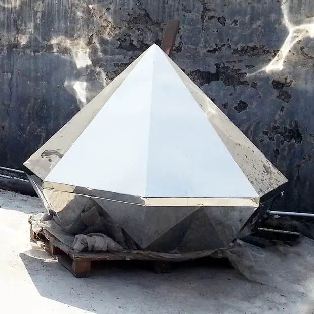 Stainless steel diamond sculpture installed at a hotel entrance