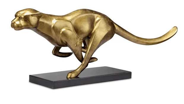 Close-up of the textured surface and detailed musculature of a brass cheetah