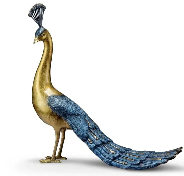 Large brass peacock sculpture as a decorative screen in a hotel lobby
