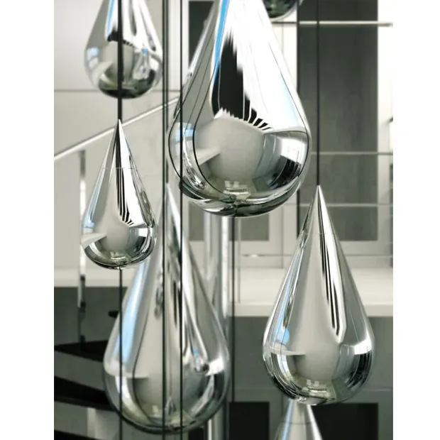 Water drop sculpture mounted on a wall in an interior space