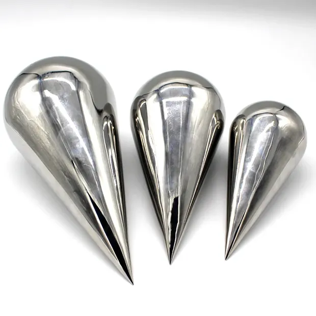 Close-up of a stainless steel water drop sculpture with reflective surface