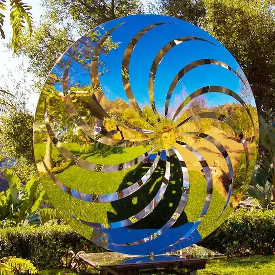 Side view of the butterfly sculpture showing the central pivot and wing structure