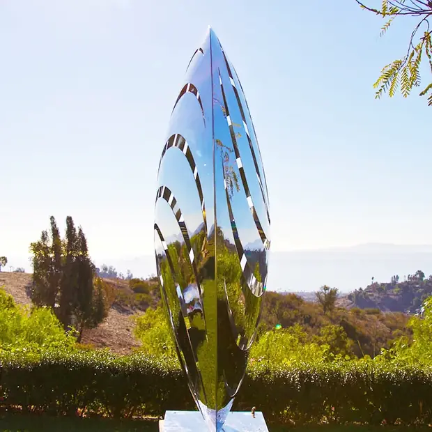 Close-up of mirror polished stainless steel butterfly wings catching light
