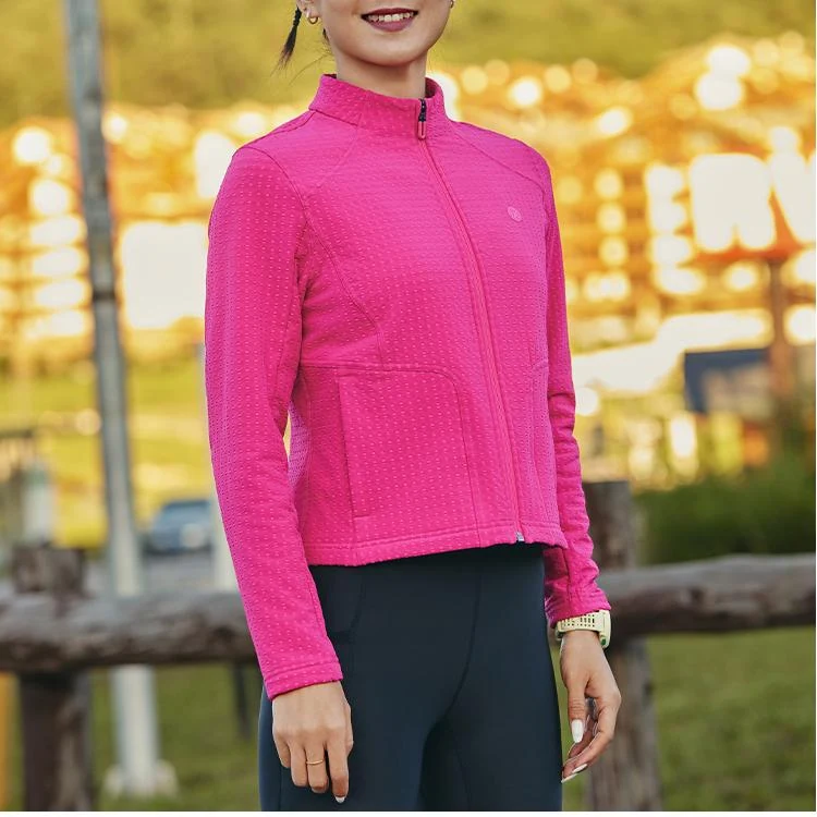 Runner wearing a Tanbei Garments running jacket photographed outdoors