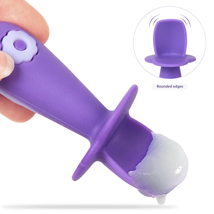 Baby spoon with textured handle shown in a small hand grip