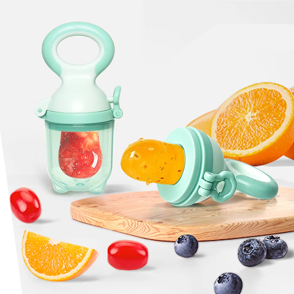 Three silicone nipples (S, M, L) laid out beside the pacifier