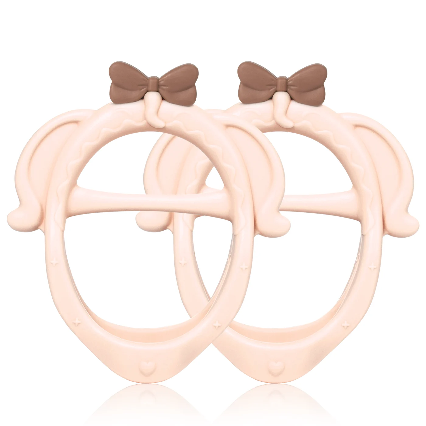Teether placed on a white surface with a baby's hand nearby for scale