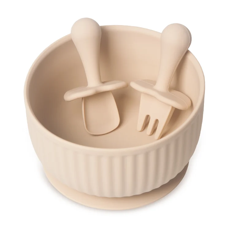 Silicone bowl with spoon and fork placed together, showing grip size