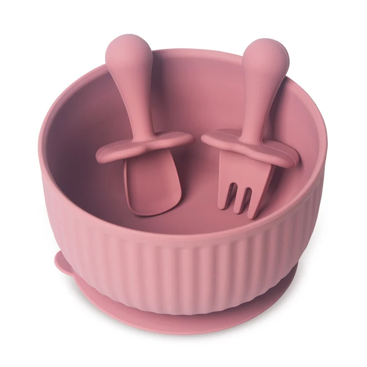 Bowl and utensils shown from the side, highlighting the short handles