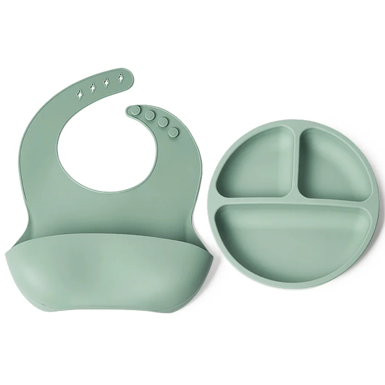Adjustable bib worn on a baby with straps fastened