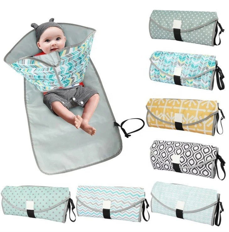 Expanded baby changing pad laid flat, showing 68x70cm size and foldable sides
