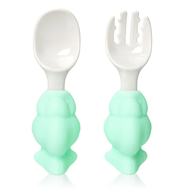Green baby spoon and fork set with the PP box open