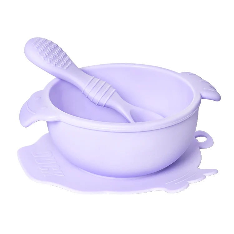 Grey duck-shaped baby bowl and spoon set standing upright