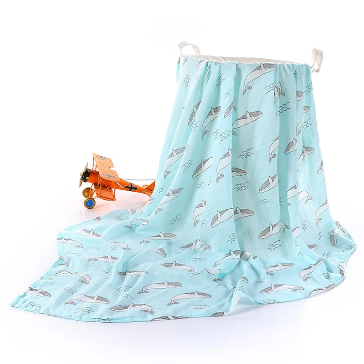 Blue bamboo cotton swaddle blanket folded in half, showing fabric texture