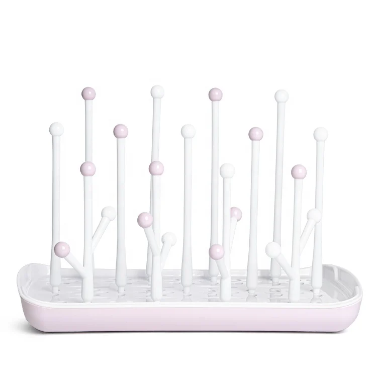 Baby bottle drying rack with the reversible drip tray in water-catching position